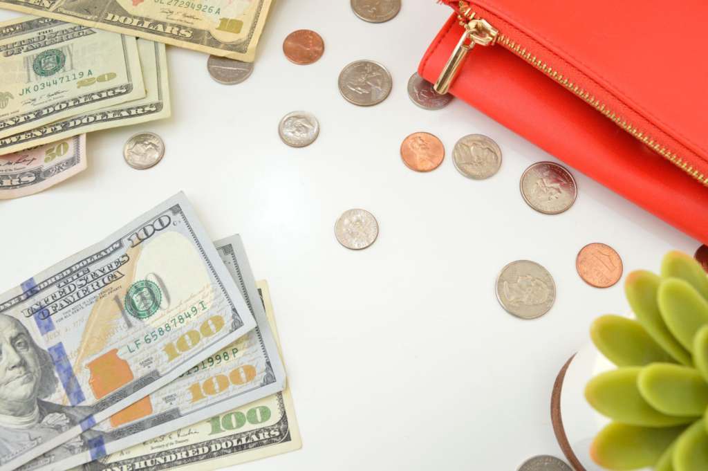 Understanding Holiday Pay as a Travel Healthcare Professional travel nurse money flat lay photo
