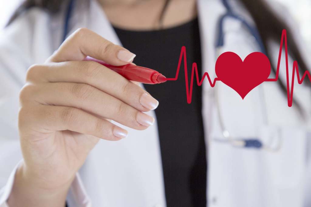 TNAA 2018: A Year in Reviews Female doctor drawing ecg heartbeat chart