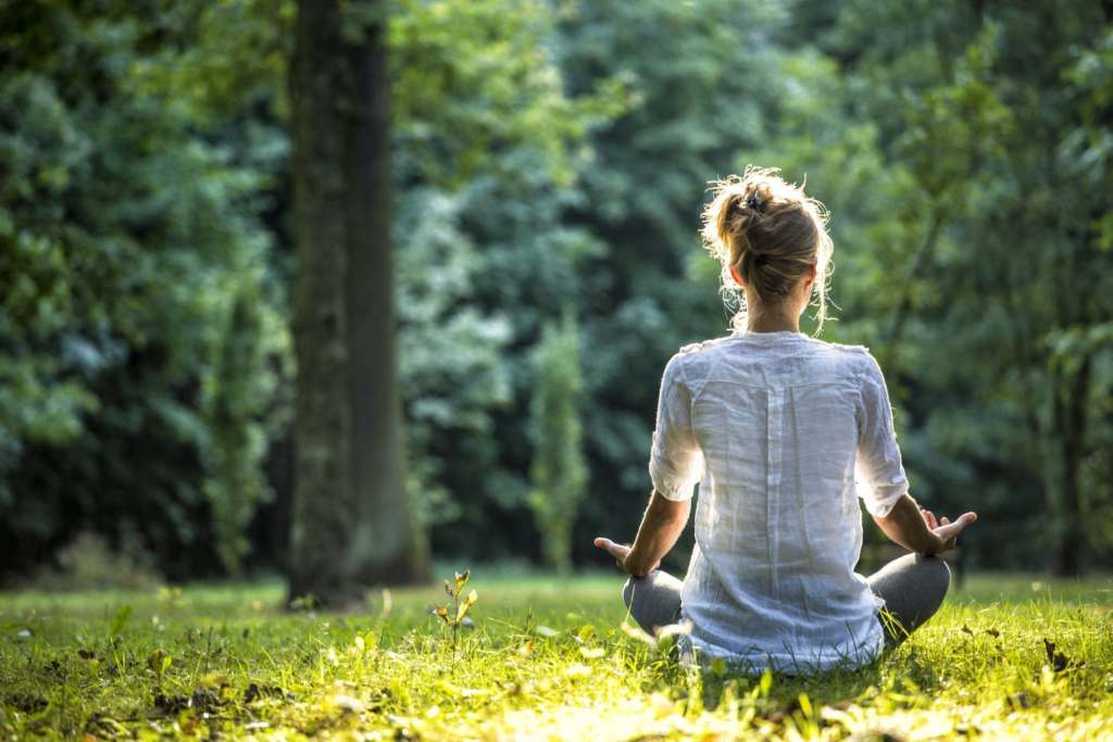 5 of Our Best Self Care Tips for Travelers Outdoor meditation