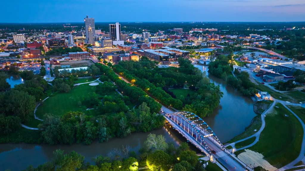 Top Indiana Spots for Your Next Travel Assignment Aerial view of downtown Fort Wayne, Indiana at dusk with city lights and skyline