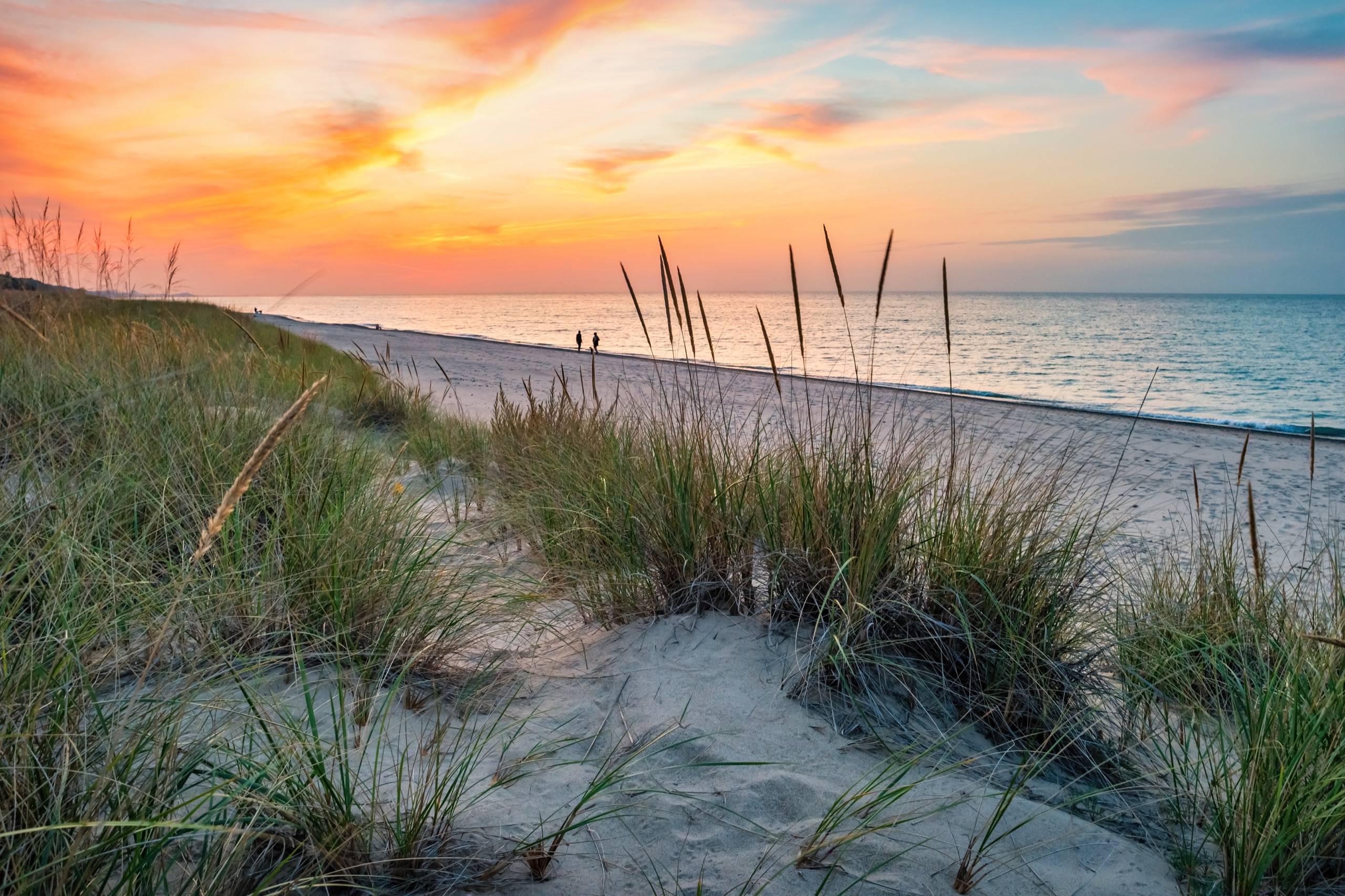 Top Indiana Spots for Your Next Travel Assignment Sandy beach and dunes at Indiana Dunes National Park along Lake Michigan