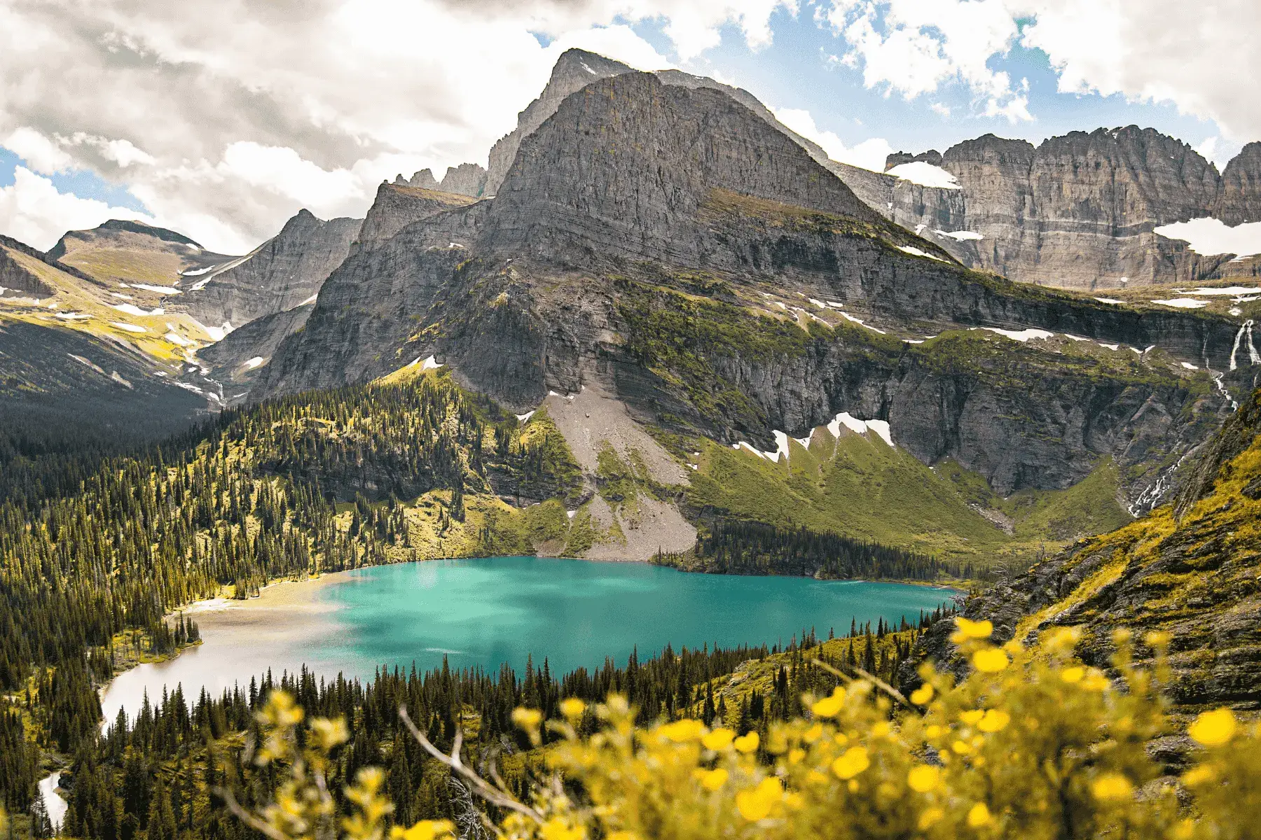 view of a mountain overlook with a lake below