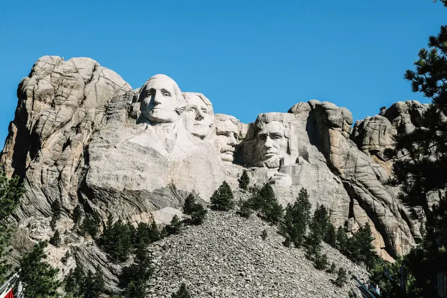Top Bucket List Things To Do During Your South Dakota Assignment Image facing Mount Rushmore featuring four U.S. Presidents